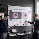 Life Only Moves Forward canvas in a living room with two people