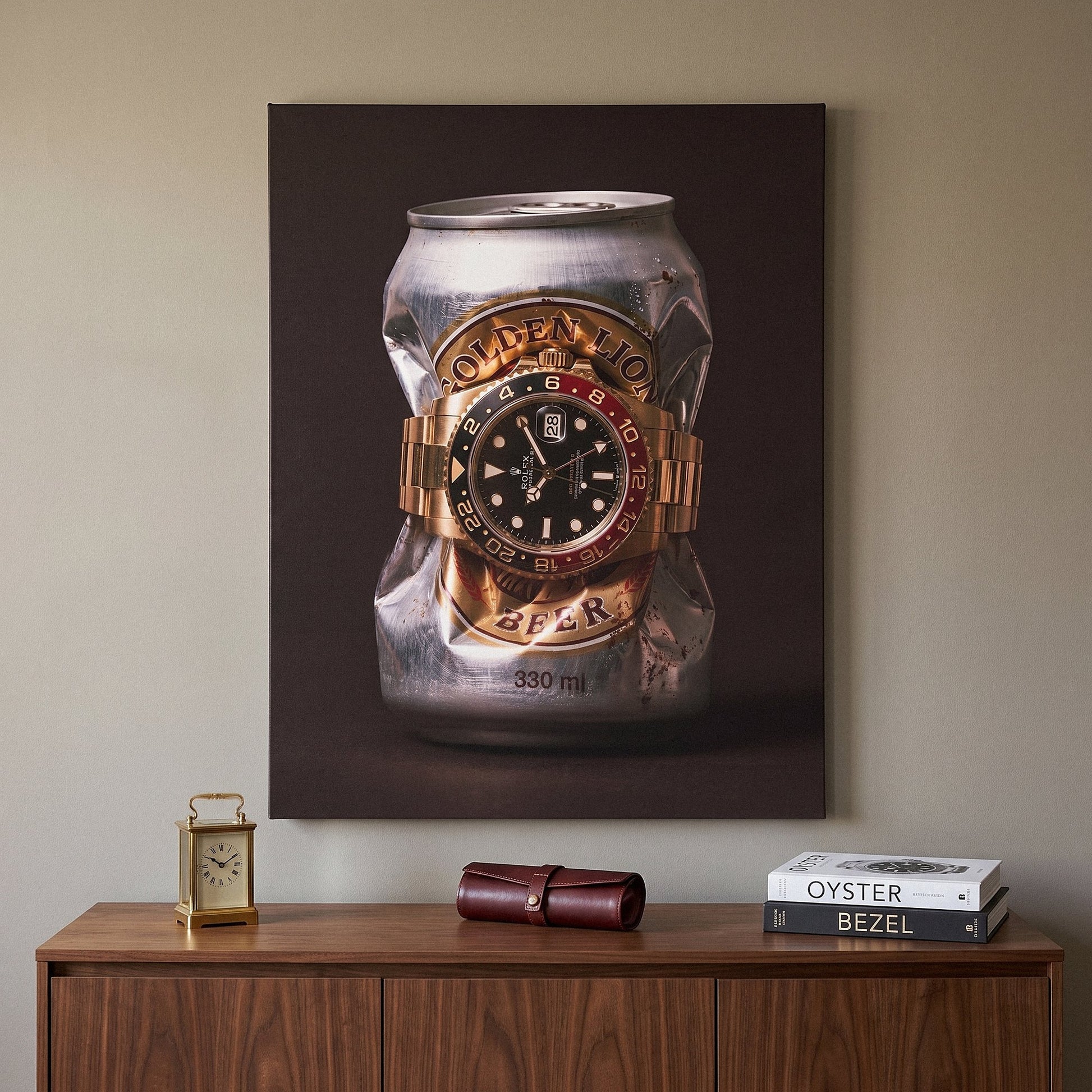 Lion's Share crushed silver beer can with a gold watch and black and red bezel canvas wall art hanging in a styled home interior
