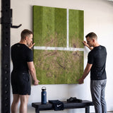 Two people viewing the London Court tennis canvas print together in a home setting