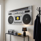Make Happiness Louder boombox canvas above a black console in an off-white entrance hall