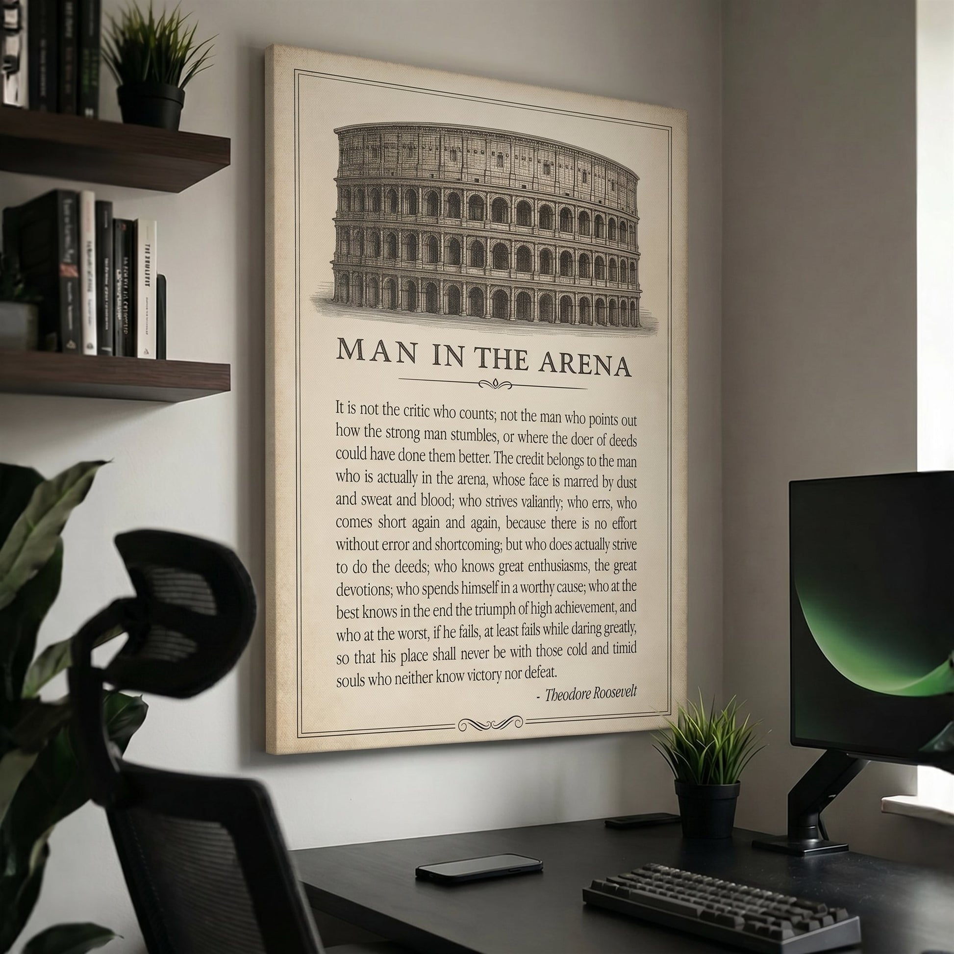 Man In The Arena Colosseum quote canvas above a modern dark desk