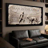 Man In The Arena marble relief canvas above a leather sofa in a den