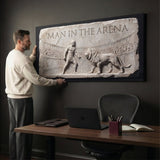 Man In The Arena gladiator and lion marble relief wall art in a home office