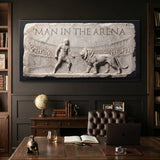 Man In The Arena marble relief canvas on a dark study wall above a walnut desk