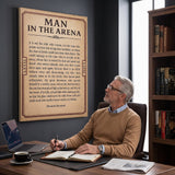 Man at a walnut desk looking up at the Man In The Arena Note Roosevelt quote canvas in his study