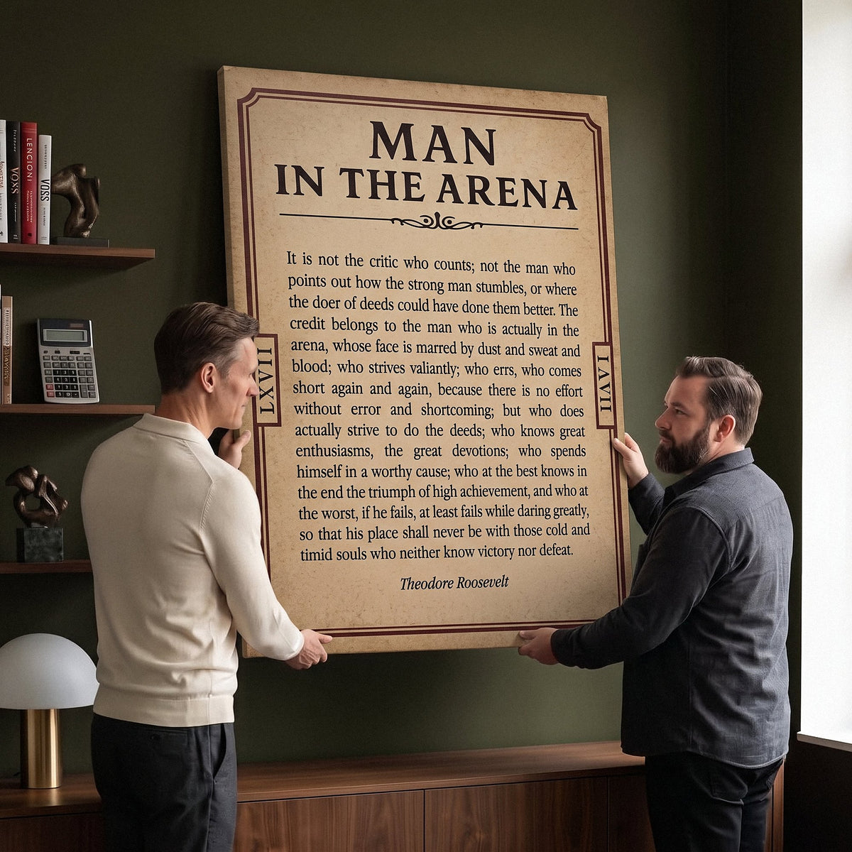 Two men holding the Man In The Arena Note Roosevelt quote canvas in a boardroom corner