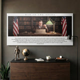 Man In The Arena Theodore Roosevelt quote canvas on a dark study wall above a walnut credenza