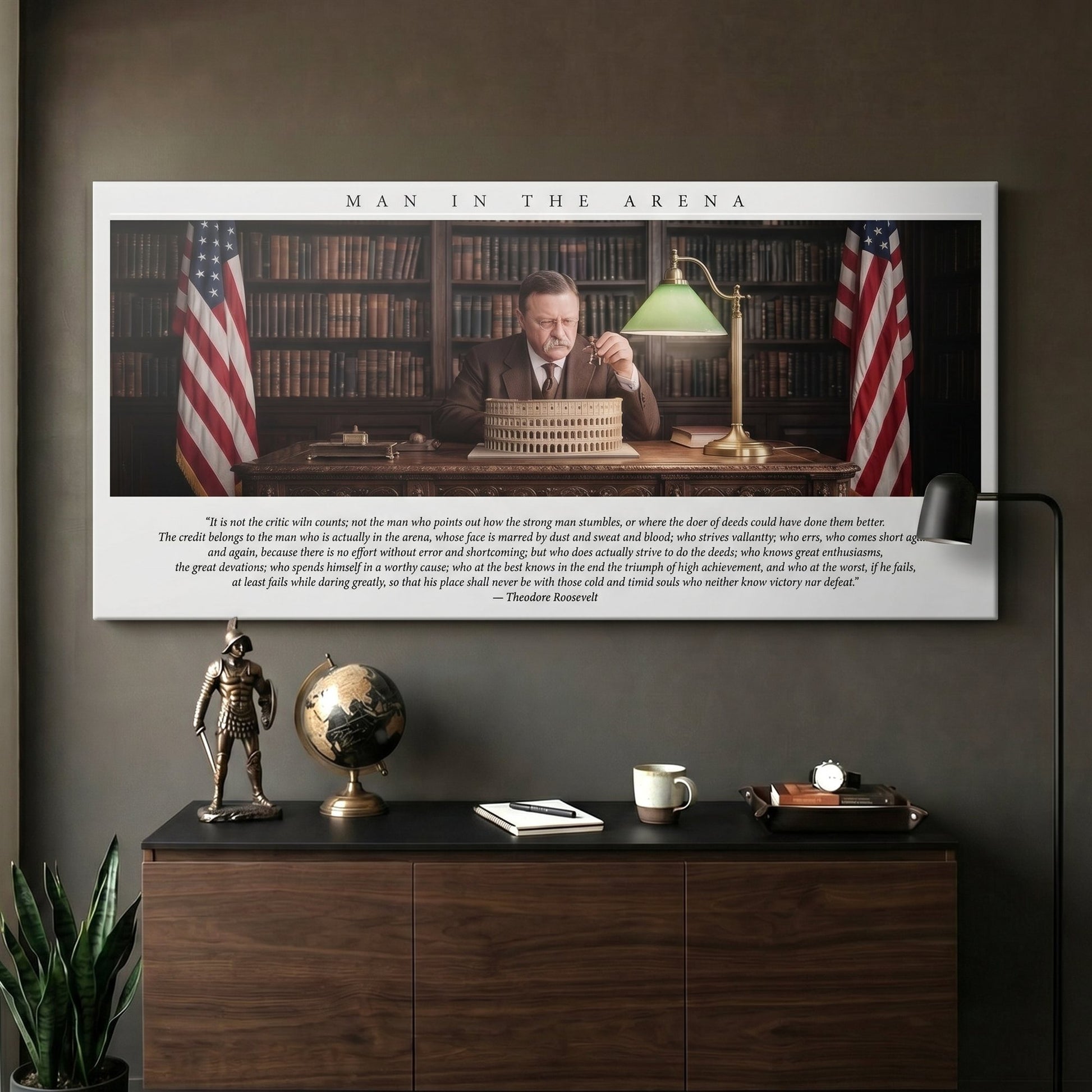 Man In The Arena Theodore Roosevelt quote canvas on a dark study wall above a walnut credenza