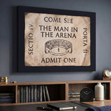 Come See The Man In The Arena ticket canvas above a credenza in a naval-history study