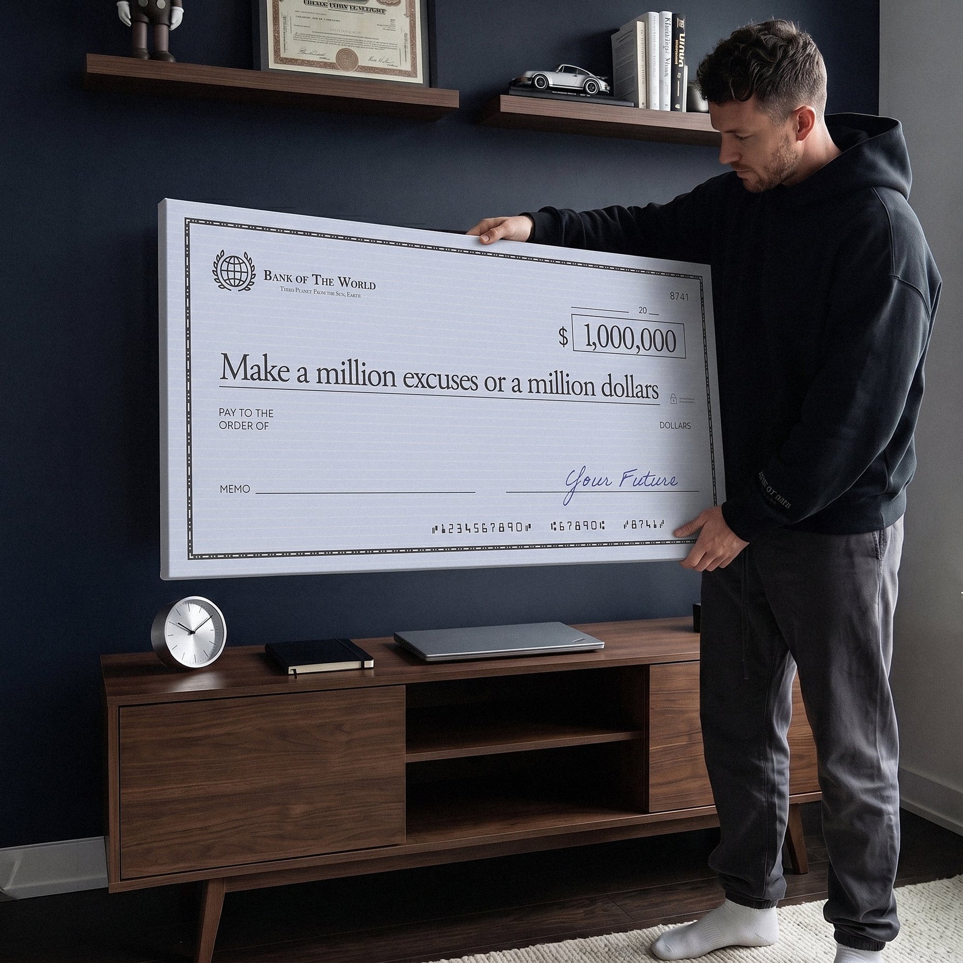 Man holding the Million Excuses Dollar Edition million dollar check canvas in a navy home office