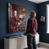 Mozart Remastered canvas above a desk with a person looking at it