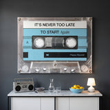 Never Too Late blue cassette canvas hanging on the wall of a modern home office