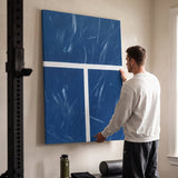 Person admiring the New York Court tennis canvas print in a styled interior