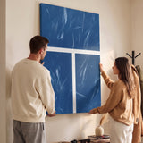 Two people viewing the New York Court tennis canvas print together in a home setting