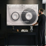 Life Has No Rewind cassette canvas above a black console with designer figures in a modern space
