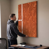 Person admiring the Paris Court tennis canvas print in a styled interior