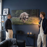 Power Hides In The Shadows wall art in a navy living room with two men looking at it