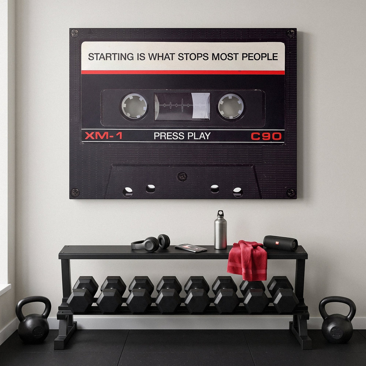 Press Play black cassette canvas hanging on the wall of a modern home office