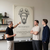 Three men discussing the Stoic Mindset Marcus Aurelius canvas in a living room