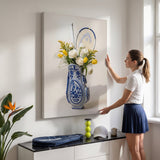 Woman in a white tennis polo leveling the Tennis Vase canvas on a bone white wall
