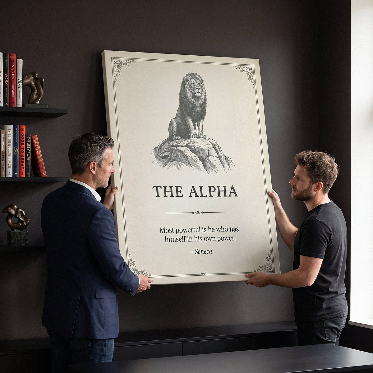 Two men carrying The Alpha lion quote canvas in a home office