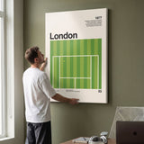 Man hanging the The London Slam tennis canvas print on a wall