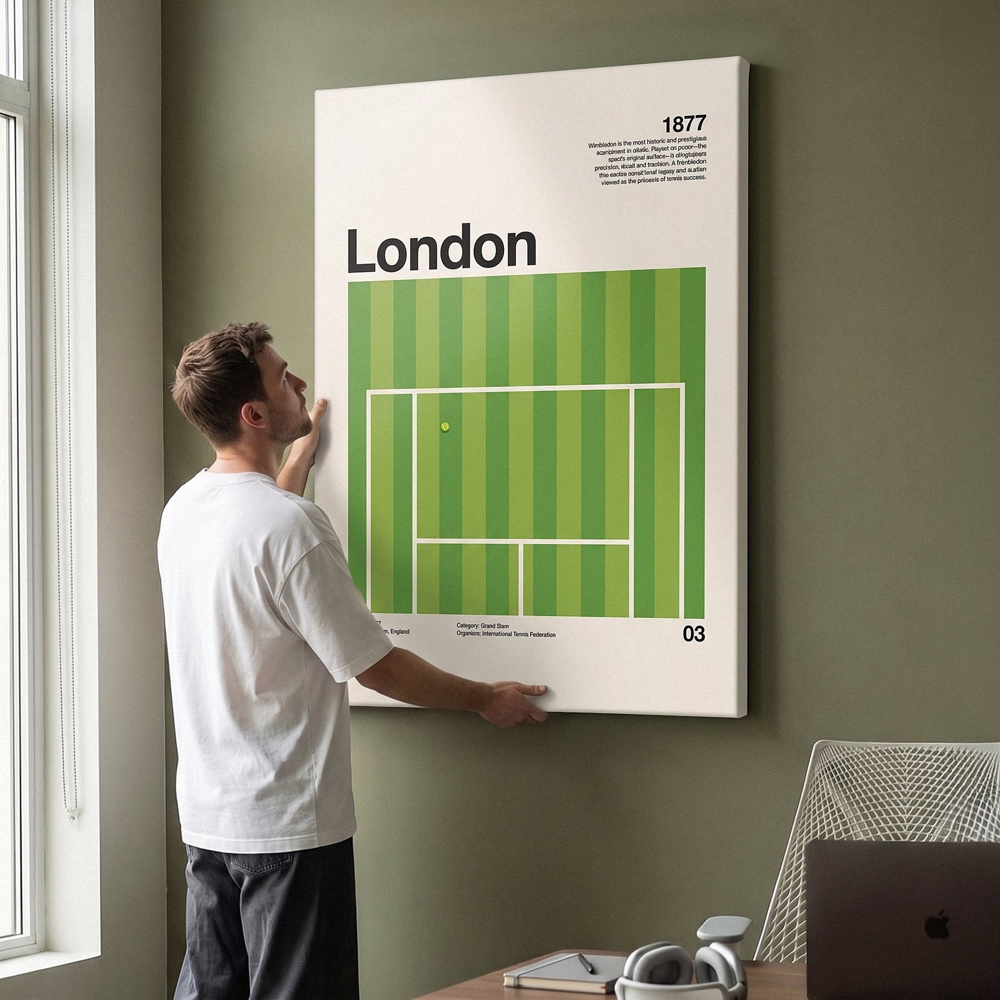 Man hanging the The London Slam tennis canvas print on a wall