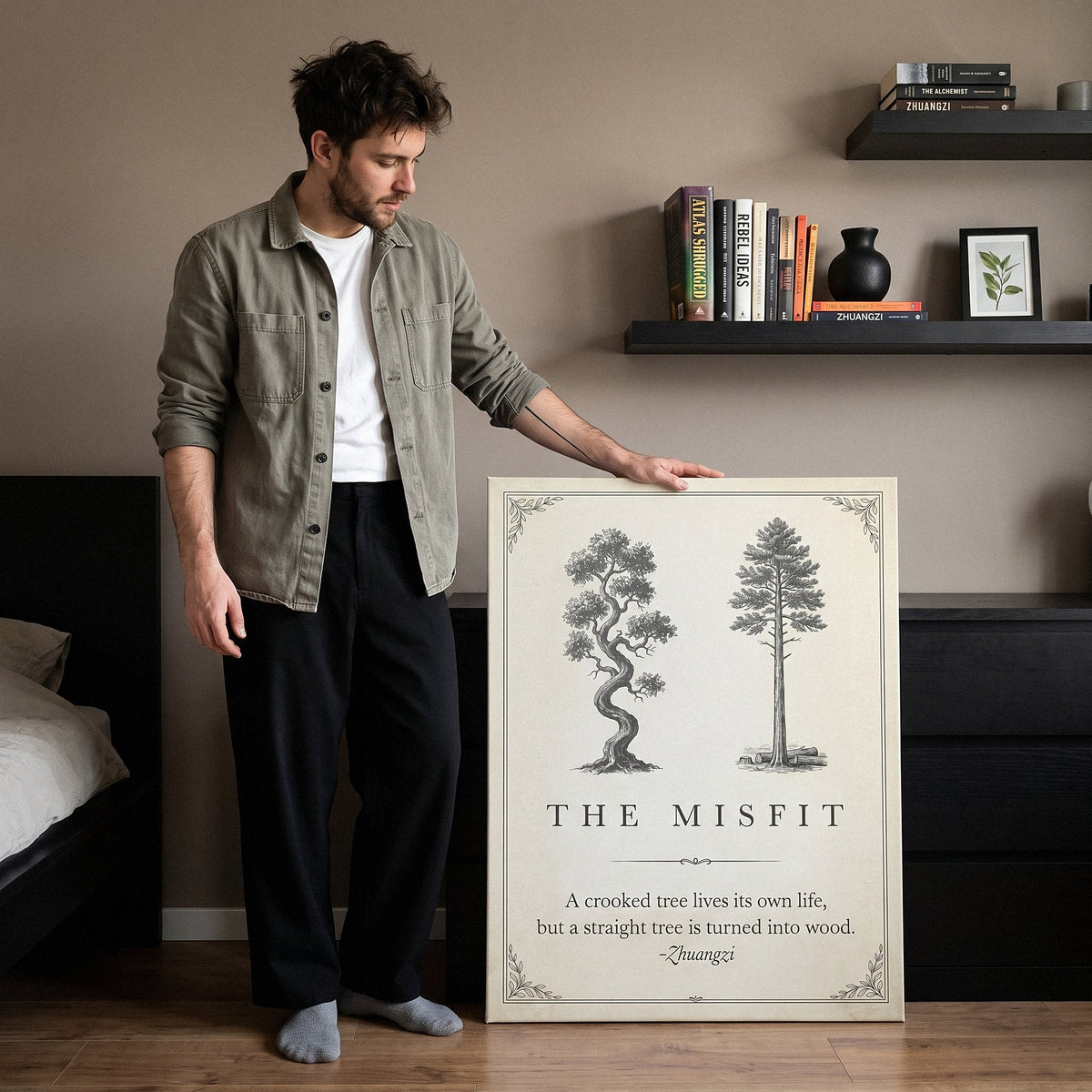 Man beside The Misfit tree quote canvas leaning on the bedroom floor