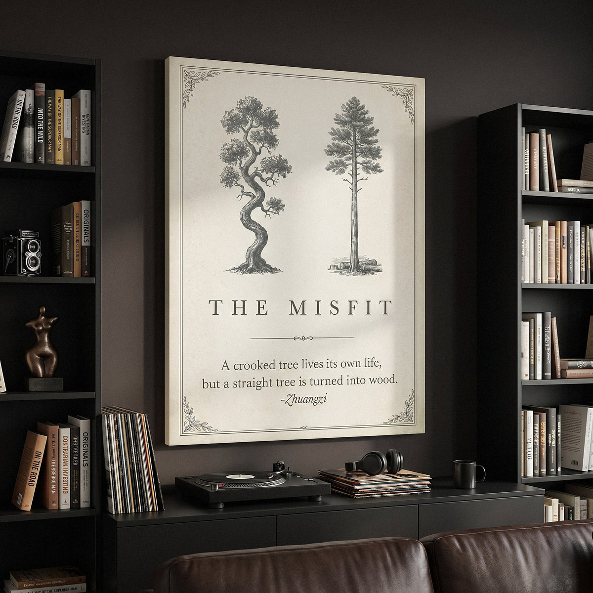 The Misfit tree quote canvas beside black bookcases in a dark living room