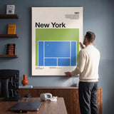 Man hanging the The New York Slam tennis canvas print on a wall
