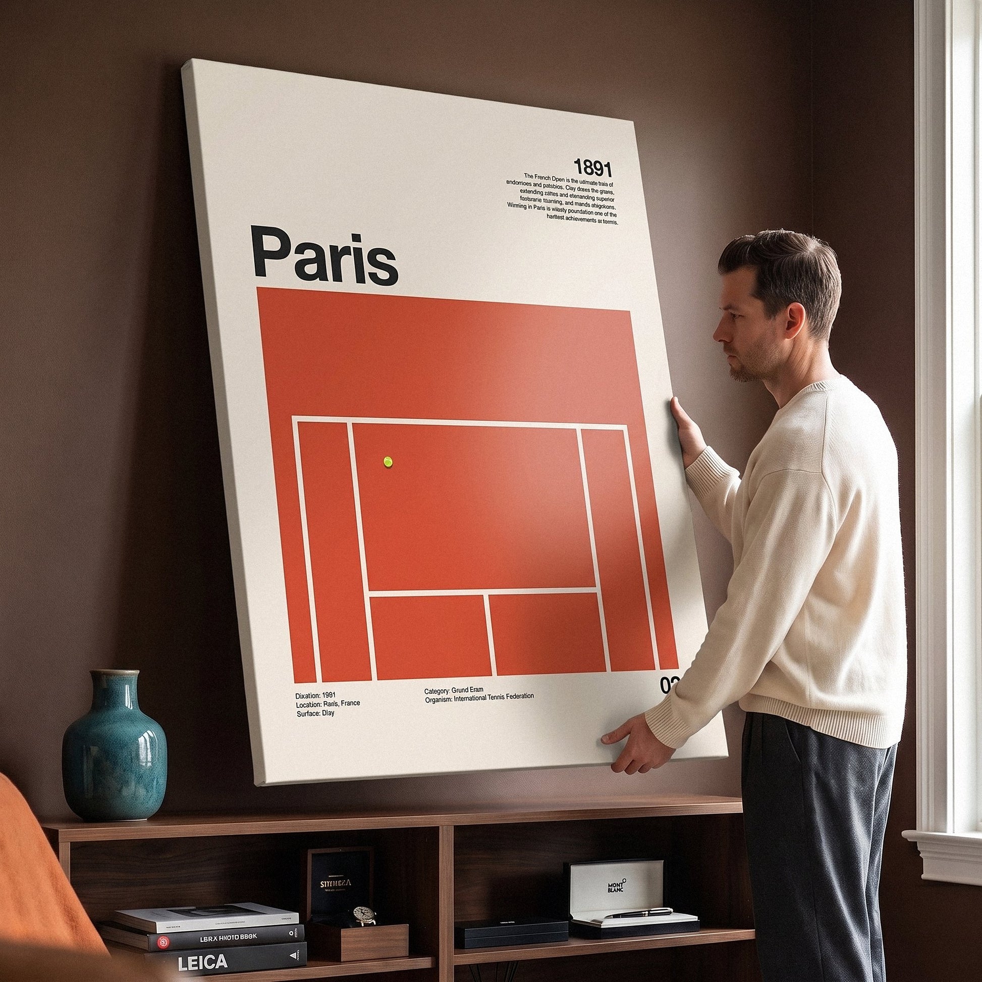 Man holding the The Paris Slam tennis canvas print against a wall