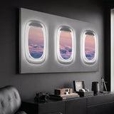Window Seat Clouds Edition airplane window clouds canvas on a charcoal wall above a black sideboard