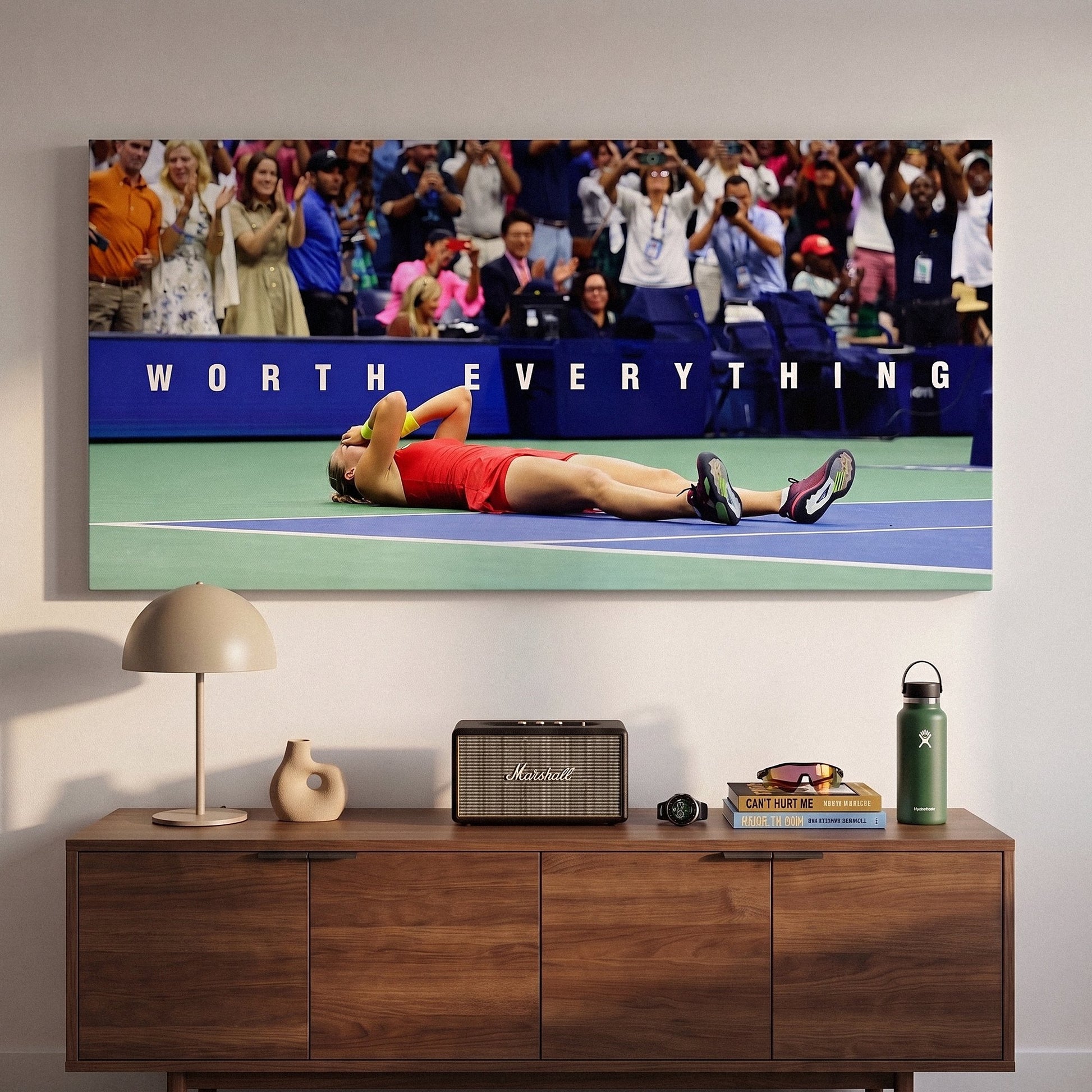Worth Everything tennis wall art canvas above a console table in a bright modern hallway