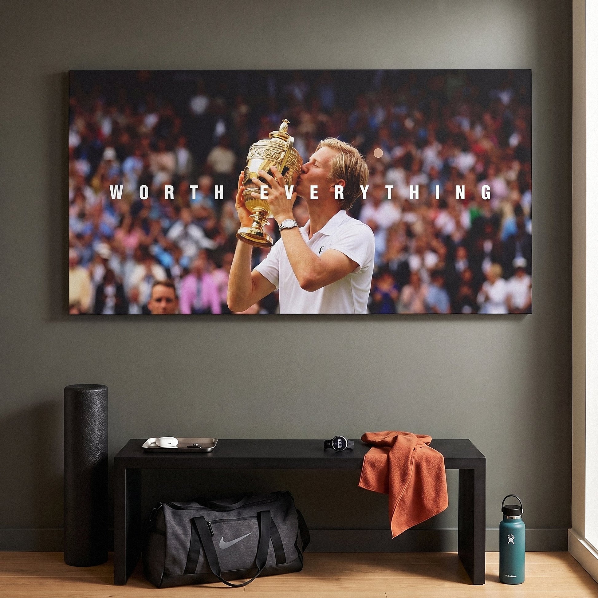Worth Everything Trophy tennis wall art canvas above a console table in a bright modern hallway